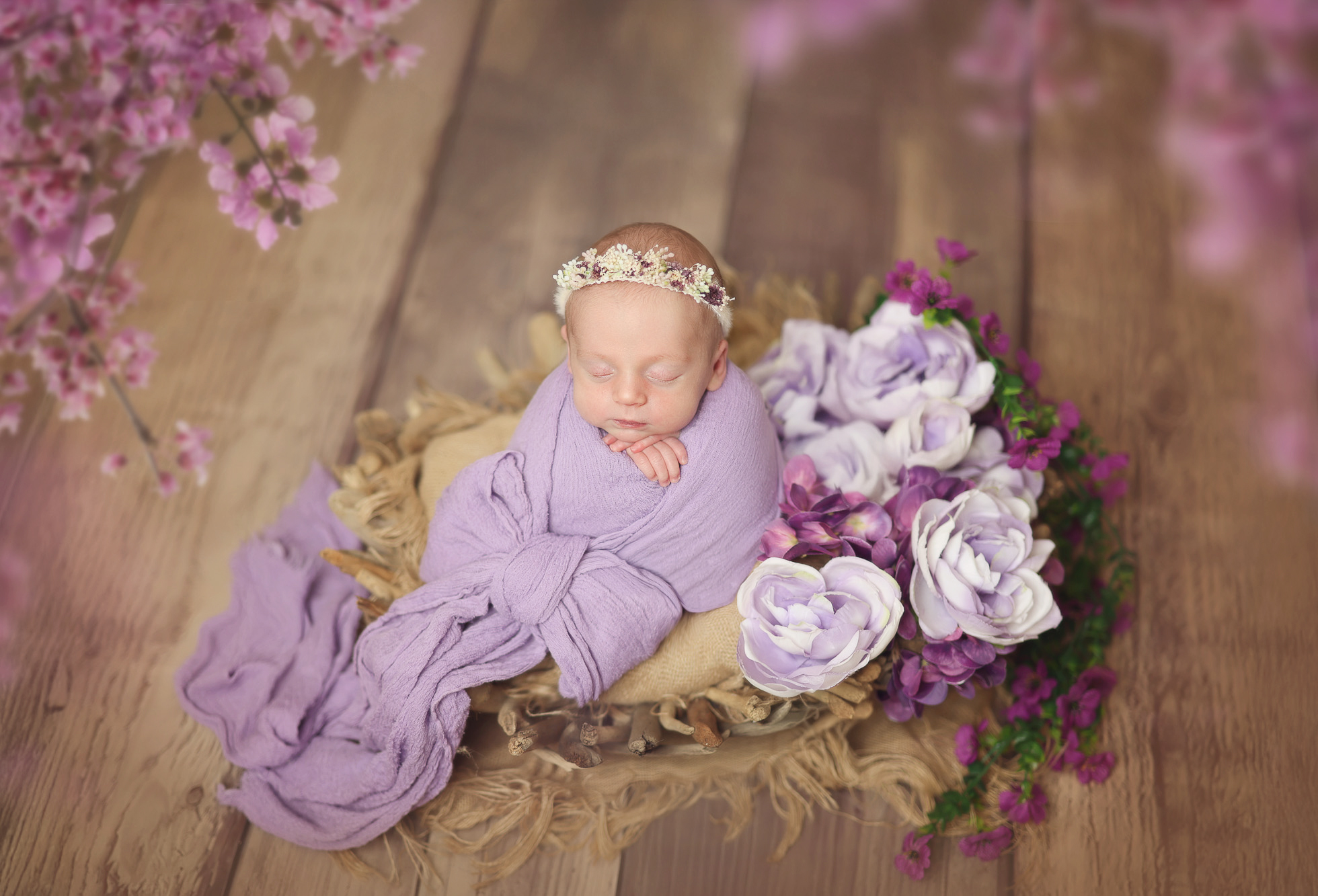 Newborn photography Columbus OH – baby wrapped in lavender with florals
