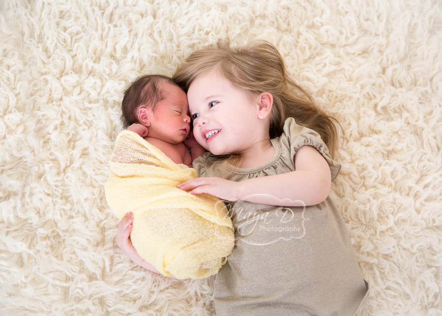 newborn and sibling 